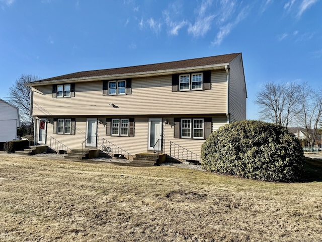 view of front of property with a front lawn