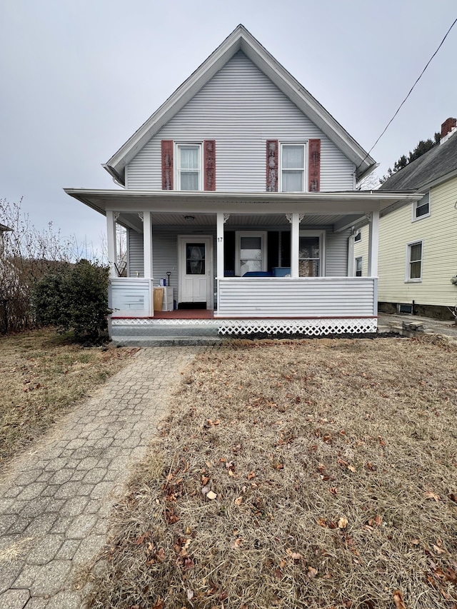 view of front facade featuring a porch and cooling unit