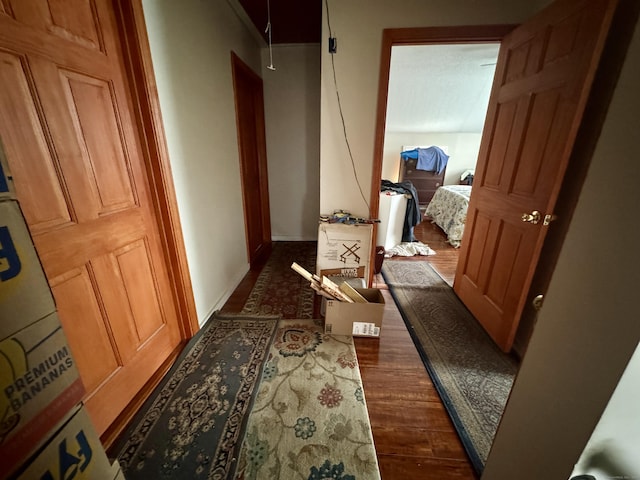 hall with dark hardwood / wood-style floors