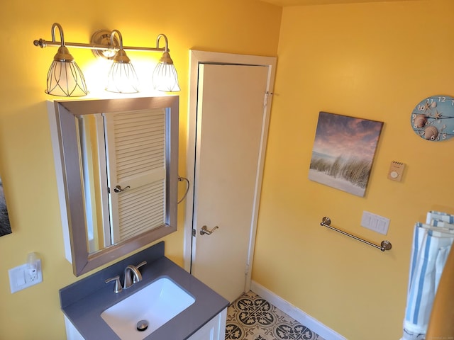 bathroom with tile patterned flooring and vanity