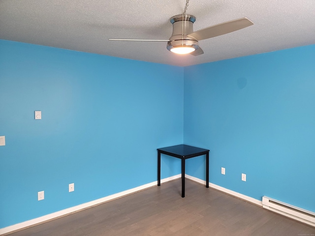 unfurnished room featuring a textured ceiling, dark hardwood / wood-style flooring, ceiling fan, and a baseboard heating unit