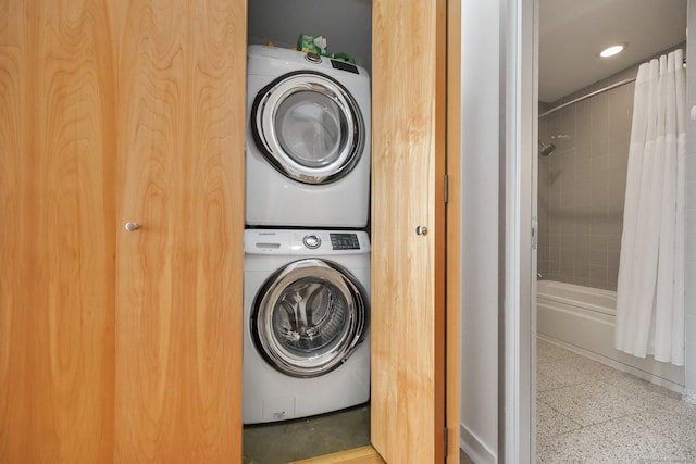 laundry area with stacked washer / dryer