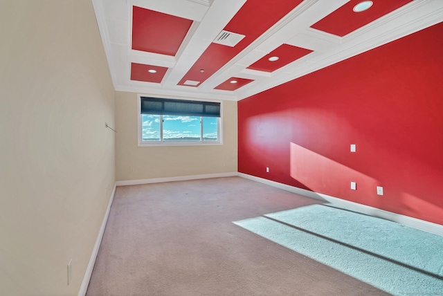 carpeted empty room featuring beam ceiling, coffered ceiling, and ornamental molding