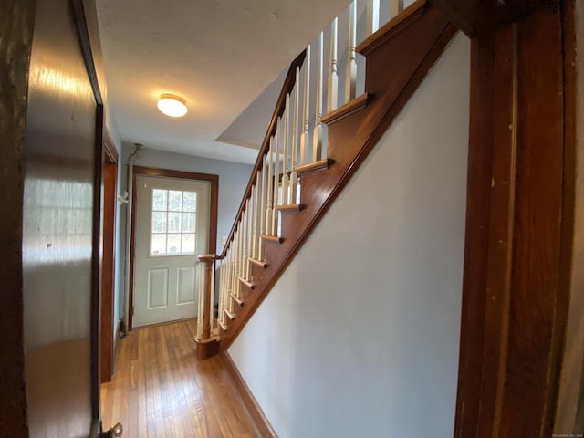 stairway featuring hardwood / wood-style floors