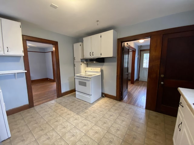 kitchen with white cabinets and white range with electric stovetop