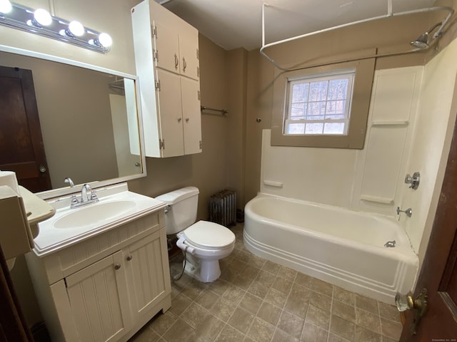 full bathroom featuring bathing tub / shower combination, radiator, vanity, and toilet