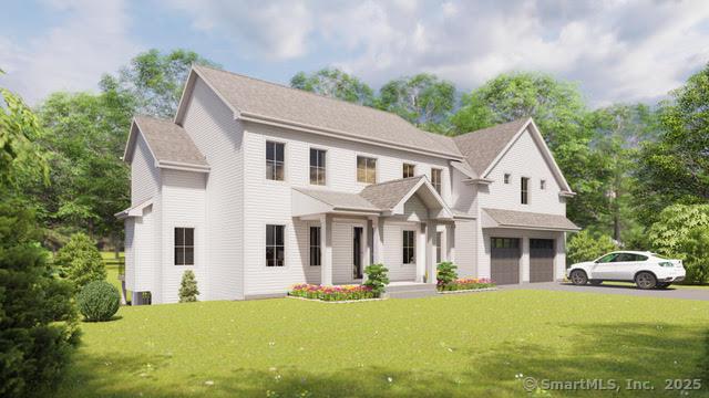 view of front of home featuring a garage and a front lawn