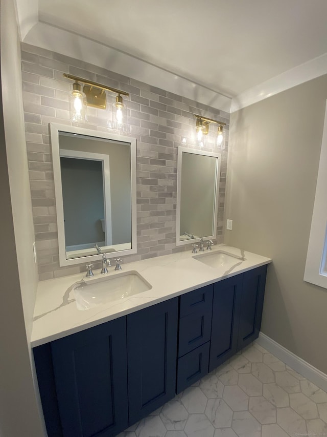 bathroom with tile patterned flooring, vanity, and crown molding