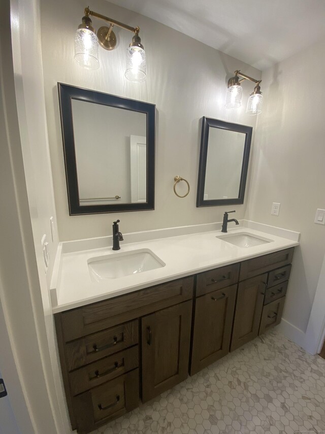 bathroom featuring tile patterned flooring and vanity