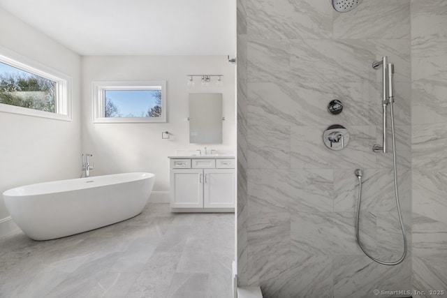 bathroom featuring shower with separate bathtub and vanity