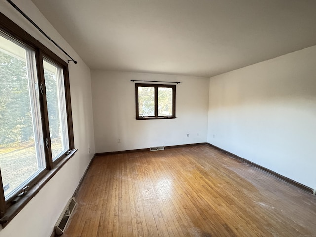 spare room featuring light wood-type flooring