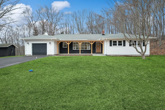 ranch-style home with a porch, a front yard, and a garage