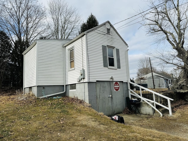 view of property exterior with a yard