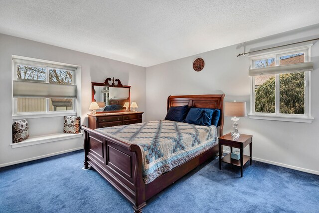 carpeted bedroom with a textured ceiling