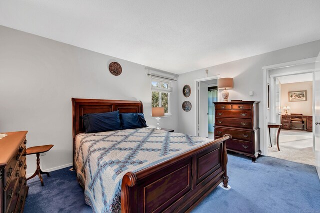 bedroom with dark carpet