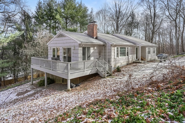 back of property featuring a deck