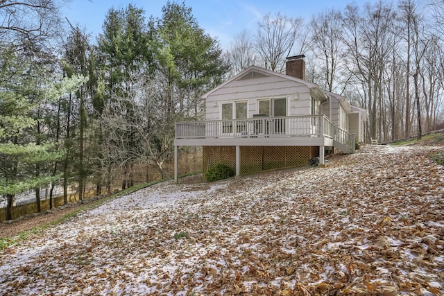 view of side of property featuring a deck