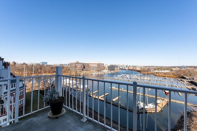 balcony featuring a water view