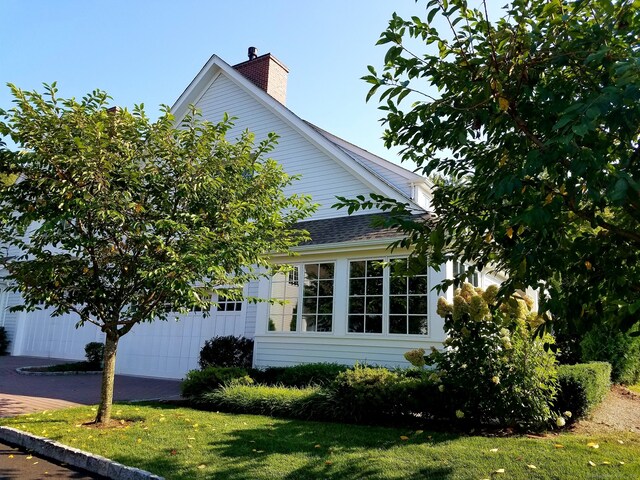 view of home's exterior featuring a lawn