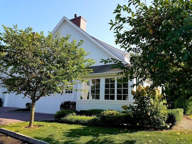 view of property exterior featuring a yard