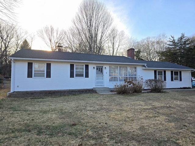 ranch-style house with a yard