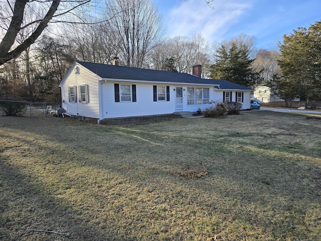 ranch-style home with a front lawn