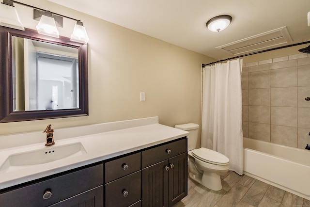 full bathroom featuring toilet, vanity, and shower / bath combo with shower curtain