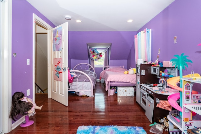 bedroom featuring vaulted ceiling and dark hardwood / wood-style floors