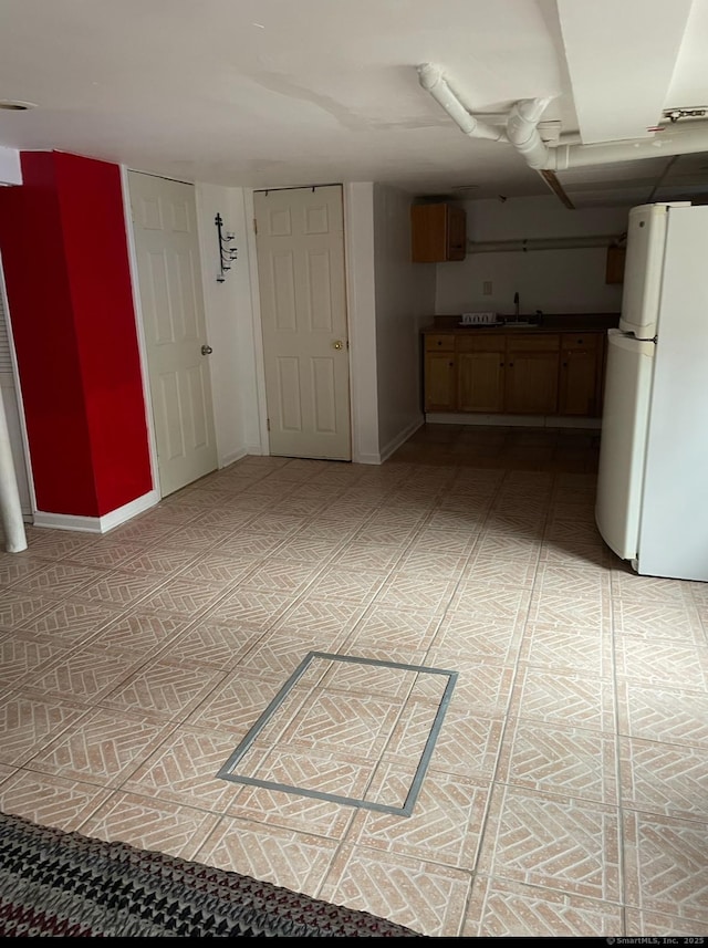 kitchen with white refrigerator and sink