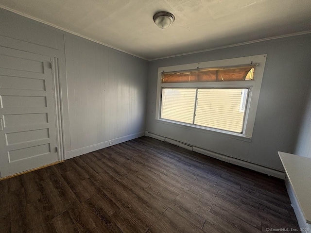 unfurnished room featuring dark hardwood / wood-style flooring and crown molding