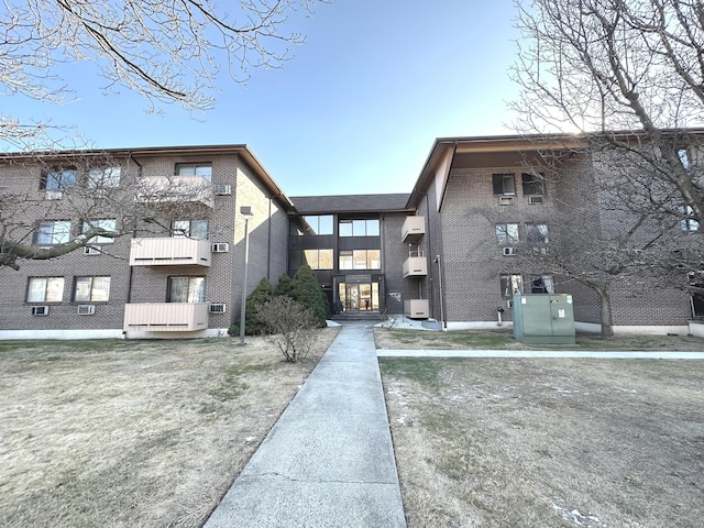 view of building exterior featuring a wall unit AC