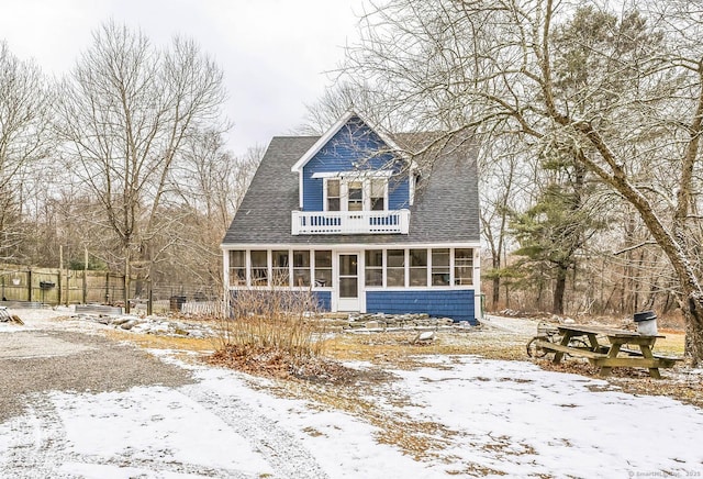 view of front facade with a sunroom