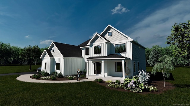 modern farmhouse with a porch and a front yard