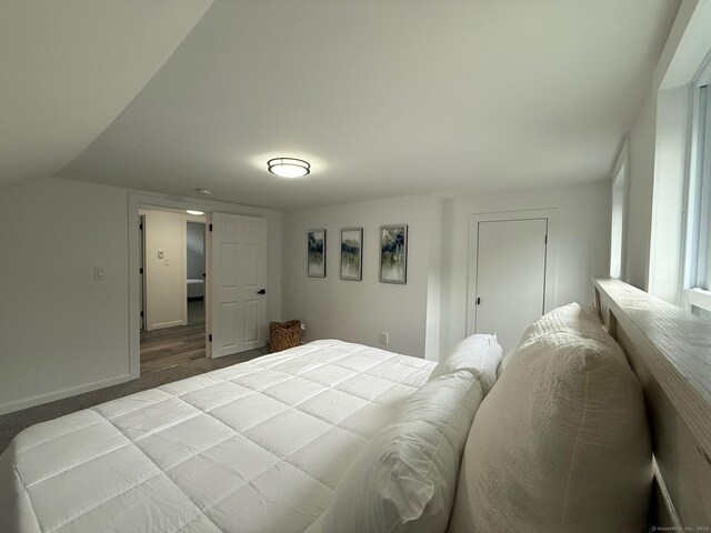 carpeted bedroom with baseboards