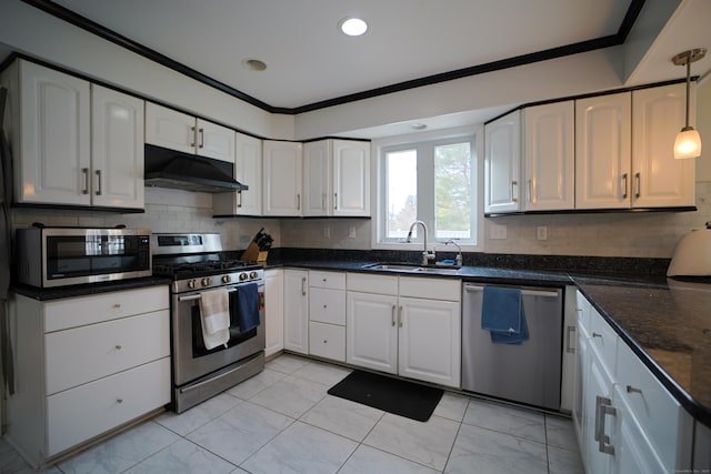 kitchen with white cabinetry, sink, pendant lighting, and appliances with stainless steel finishes