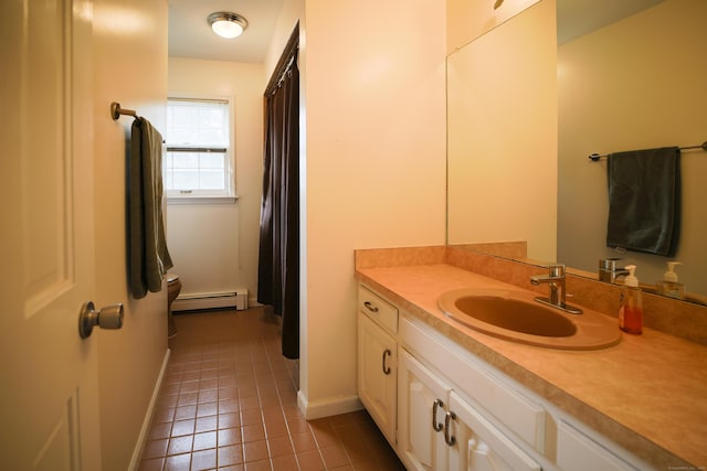 bathroom with tile patterned floors, vanity, and a baseboard radiator