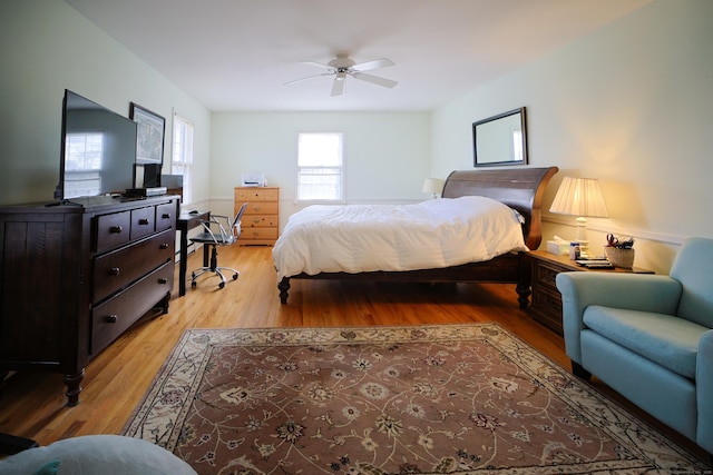 bedroom with ceiling fan and light hardwood / wood-style flooring