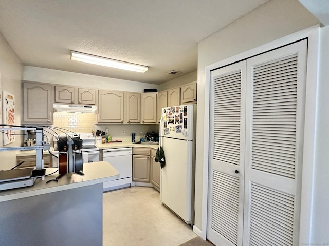 kitchen with backsplash and white appliances