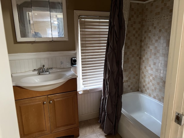 bathroom with tile patterned floors, vanity, and shower / tub combo