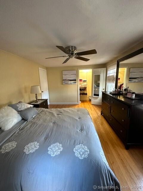 bedroom with light wood-type flooring and ceiling fan