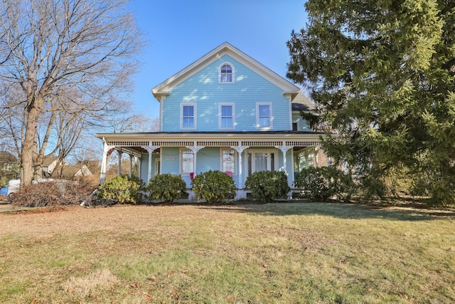 view of front of home featuring a porch and a front yard