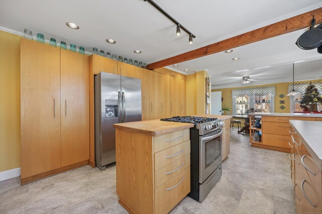 6264 Main St, Trumbull, CT 06611 - kitchen featuring stainless steel appliances, butcher block countertops, decorative light fixtures, ceiling fan, and a center island