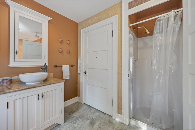 6264 Main St, Trumbull, CT 06611 - full bath with a shower stall, vanity, and baseboards