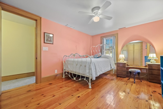 6264 Main St, Trumbull, CT 06611 - bedroom with hardwood / wood-style floors, a ceiling fan, arched walkways, and baseboards