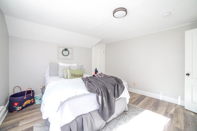 bedroom with light hardwood / wood-style floors