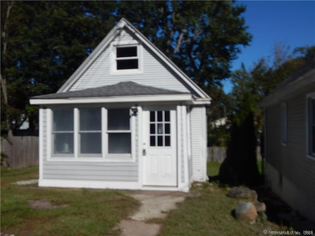 view of outdoor structure with a lawn