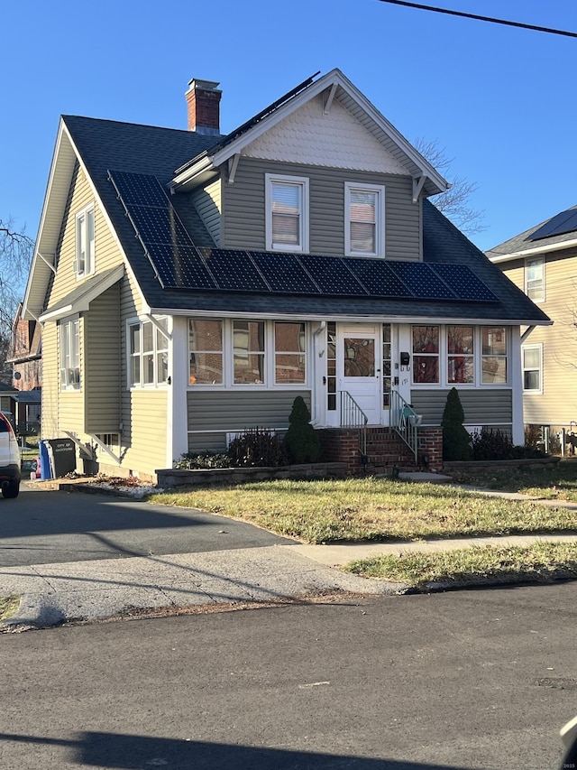 view of front of property with a front lawn