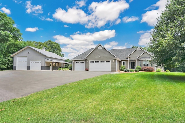 view of front of house with a front lawn and a garage