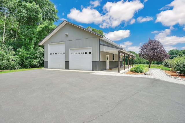 view of front of house with an outdoor structure and a garage