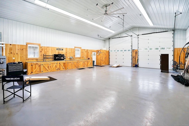 garage featuring wooden walls